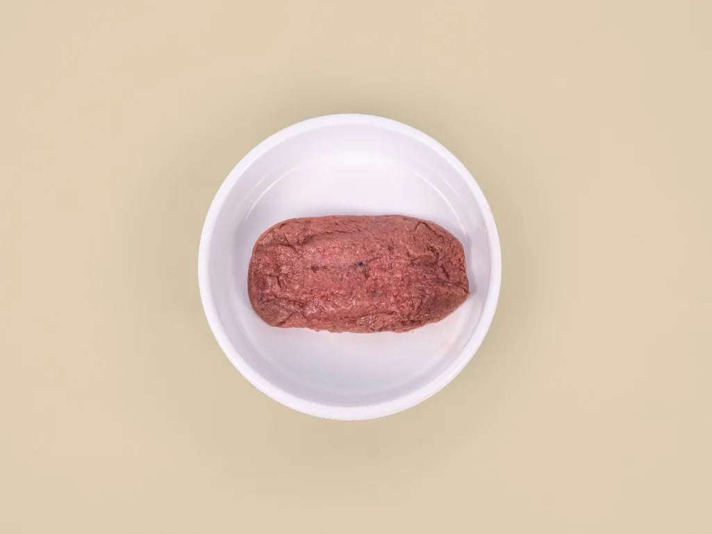 Big Dog Combo raw cat food patty served in a bowl