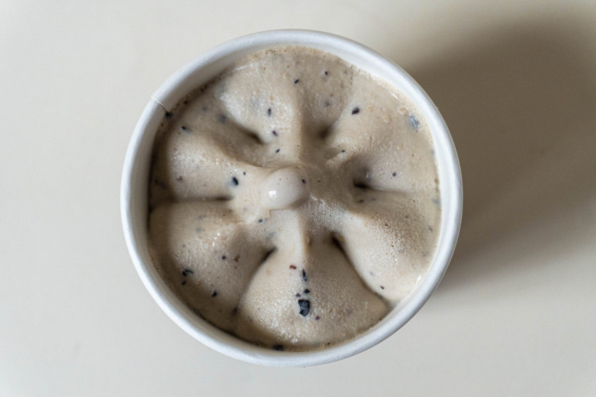 Dog Yog Blueberry & Peanut Butter dog ice cream, open pot showing the frozen swirl