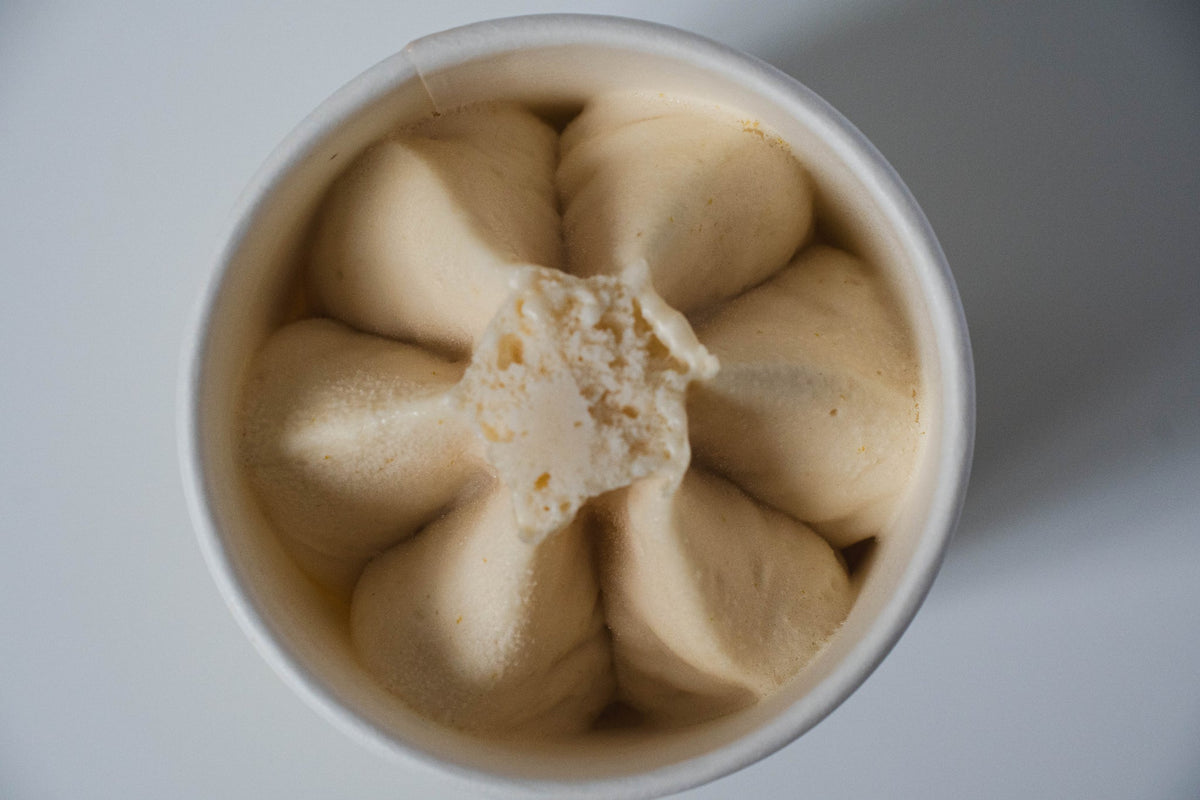 Dog Yog Banana Split dog ice cream, open pot showing the frozen swirl