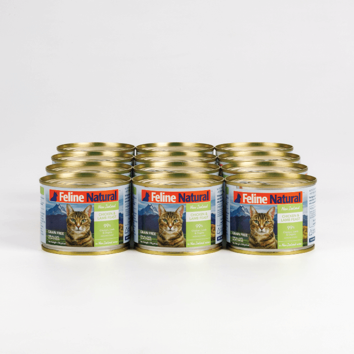 A can of Feline Natural Chicken Lamb Wet Cat Food featuring an image of a cat and New Zealand landscape, indicating the product is grain-free and includes chicken and lamb as ingredients.