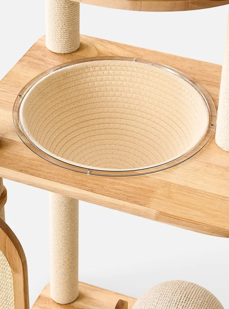 Close-up of the H02 wooden cat tree woven hammock with a circular support ring, positioned between natural wood platforms and sisal posts.