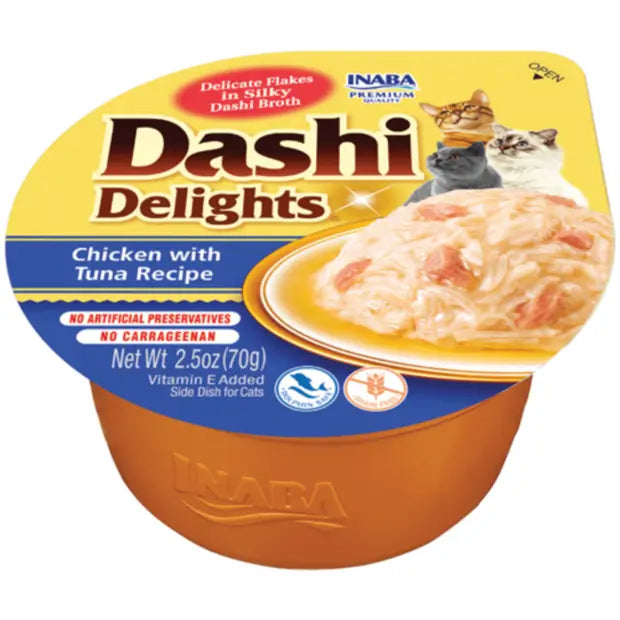 A single-serving container of Inaba Dashi Delights Chicken With Tuna Recipe Cat Treats. The container is yellow with a picture of the product and cats on the label.