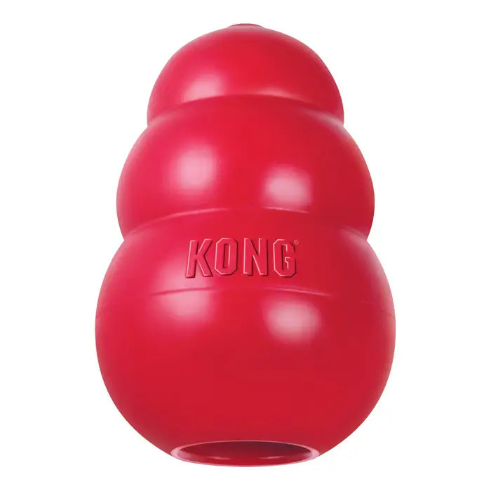 KONG Classic red natural rubber dog chew toy with hollow centre for stuffing treats and an unpredictable bounce for interactive play.