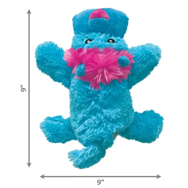 KONG Cozie blue and pink plush dog toy size guide showing approximately 9 inches in height and width with soft fluffy fabric.