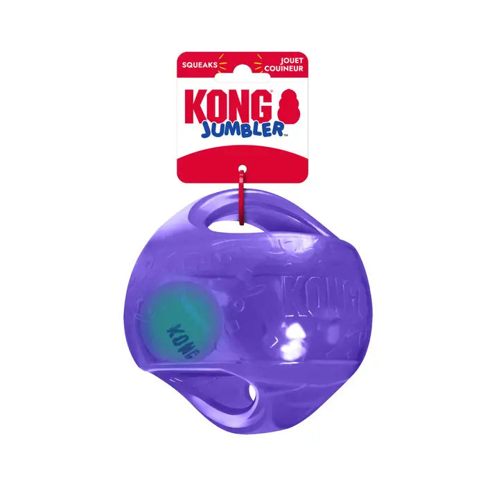 Purple KONG Jumbler Ball Dog Toy in original KONG packaging, featuring a transparent outer shell, internal tennis ball and squeaker.